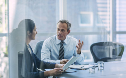 Businesspeople discussing strategy in office